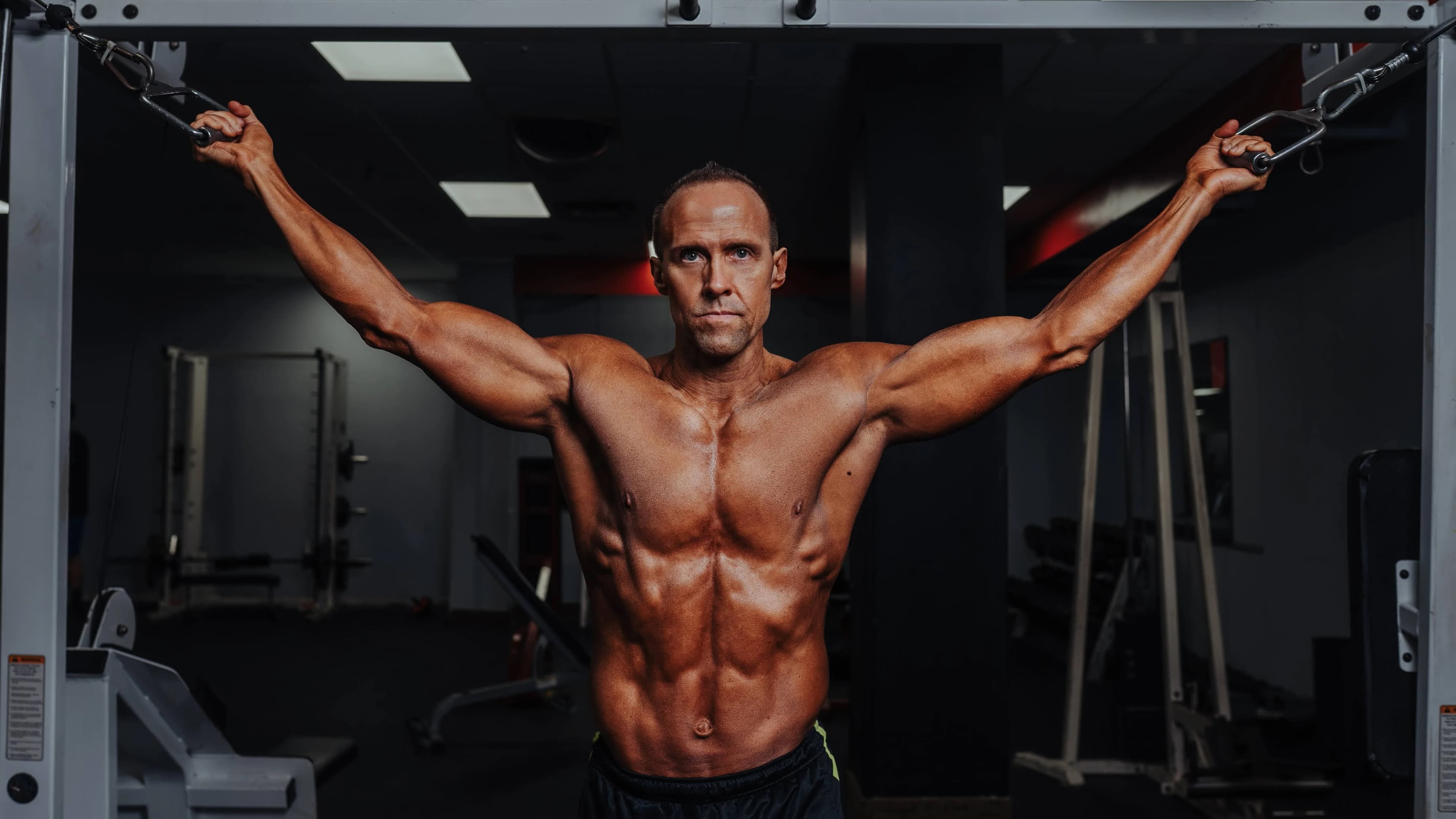 Carey Rouse holding weight stack cables